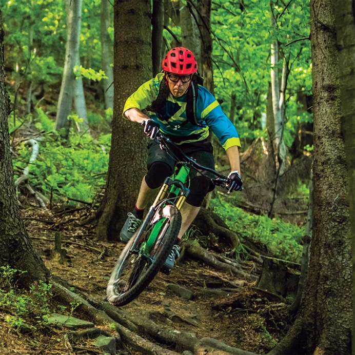 A man riding a mountain bike on a trail at Horseshoe Resort