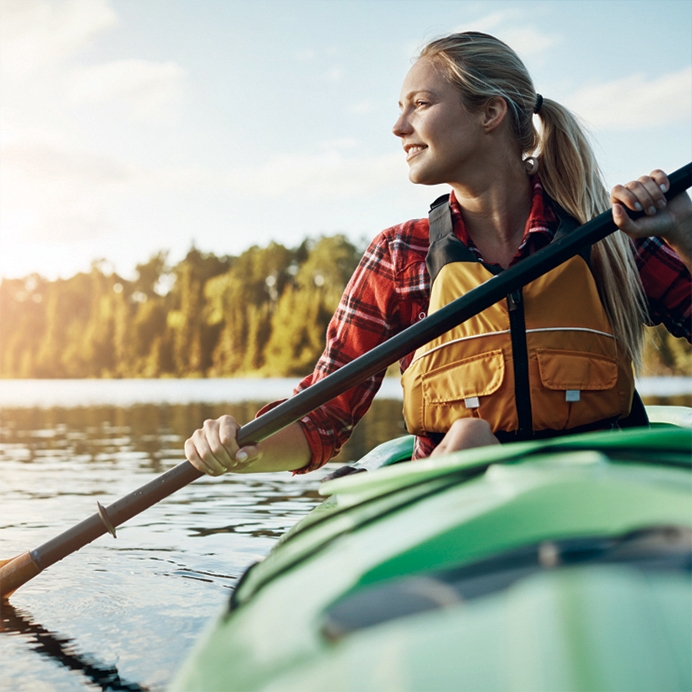 A woman kayaking at Deerhurst Resort